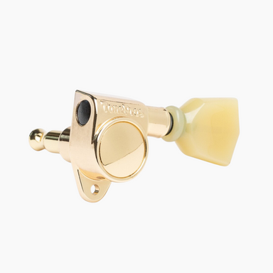 gold guitar tuning key with plastic handle side view