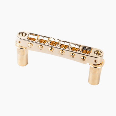 gold locking Nashville style bridge with saddle adjustment screws