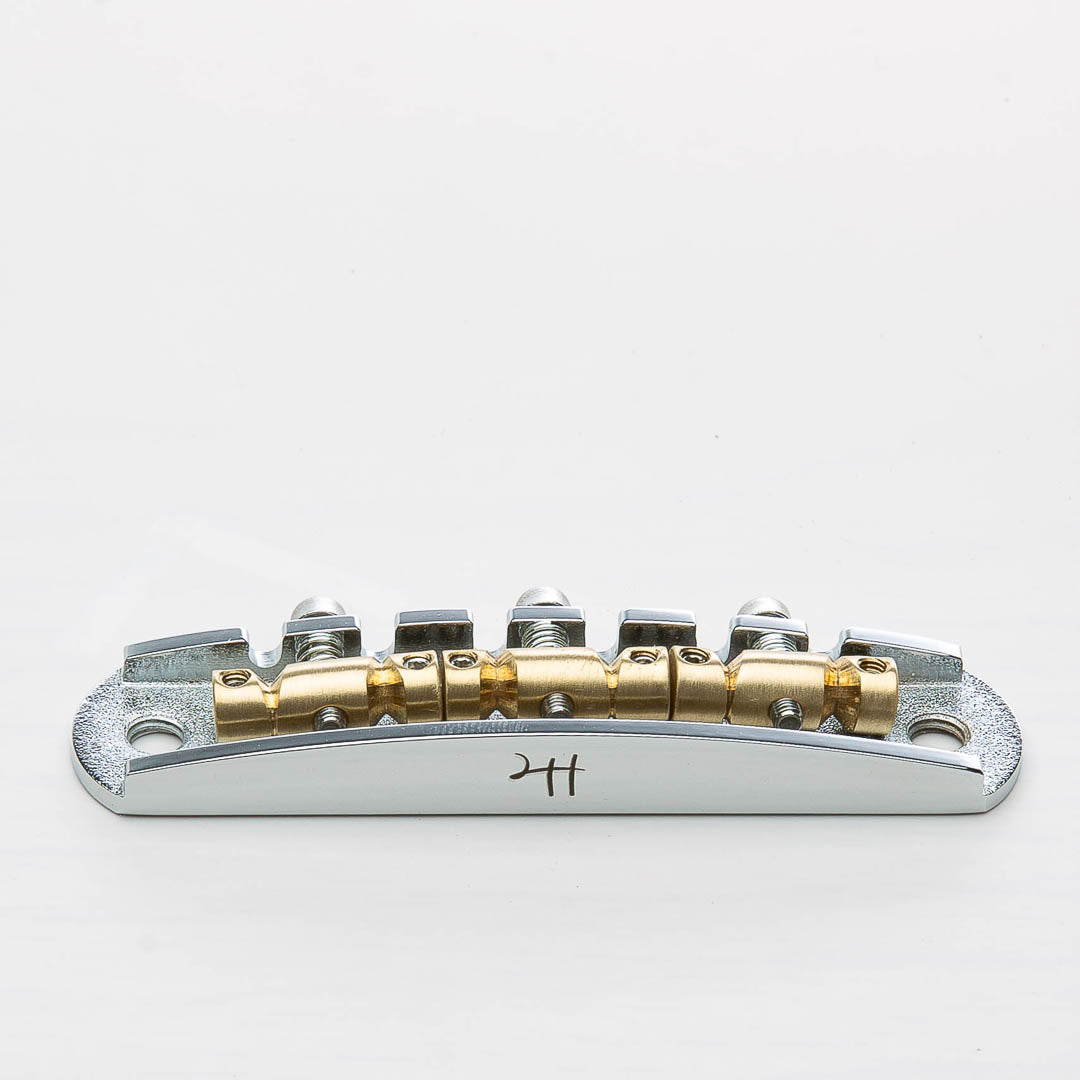 halon metric offset bridge w/ brass saddles front view chrome