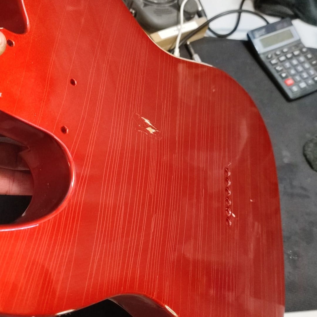 red guitar with clear coat
