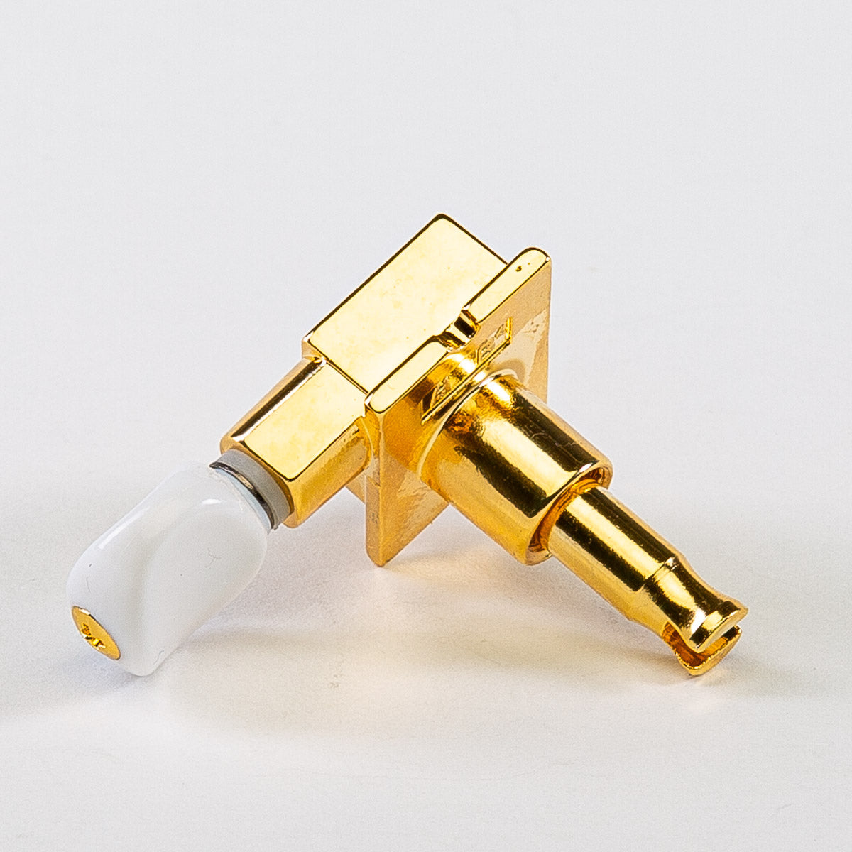 true tune 6 in-line keys w/ white plastic oval buttons single back view gold