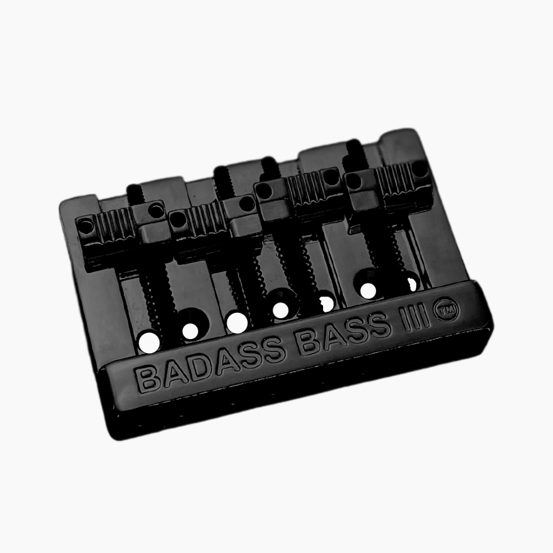 angled front view of black 4-string bass bridge version 3 with grooved saddles