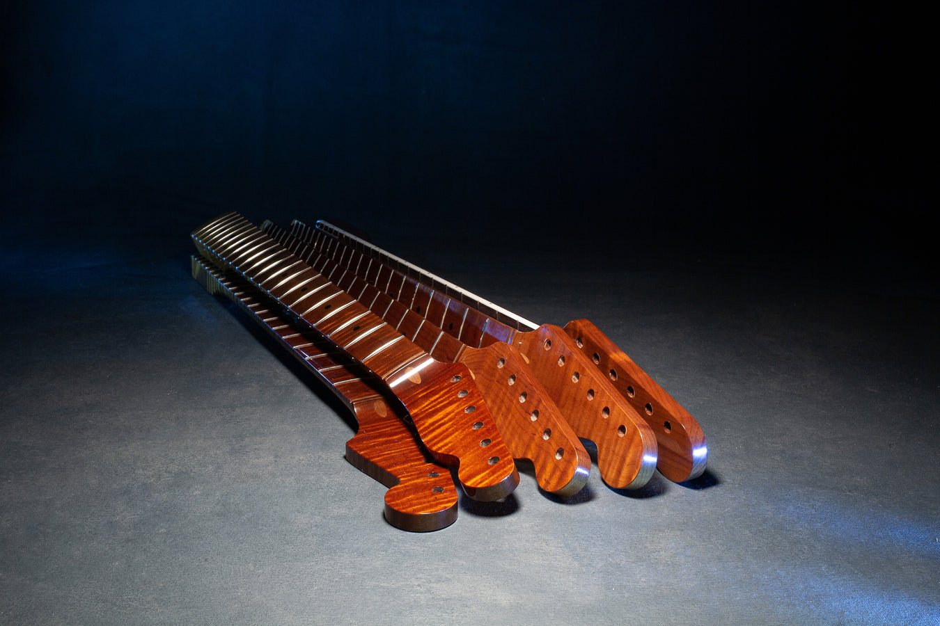 stack of premium guitar necks with shiny coating