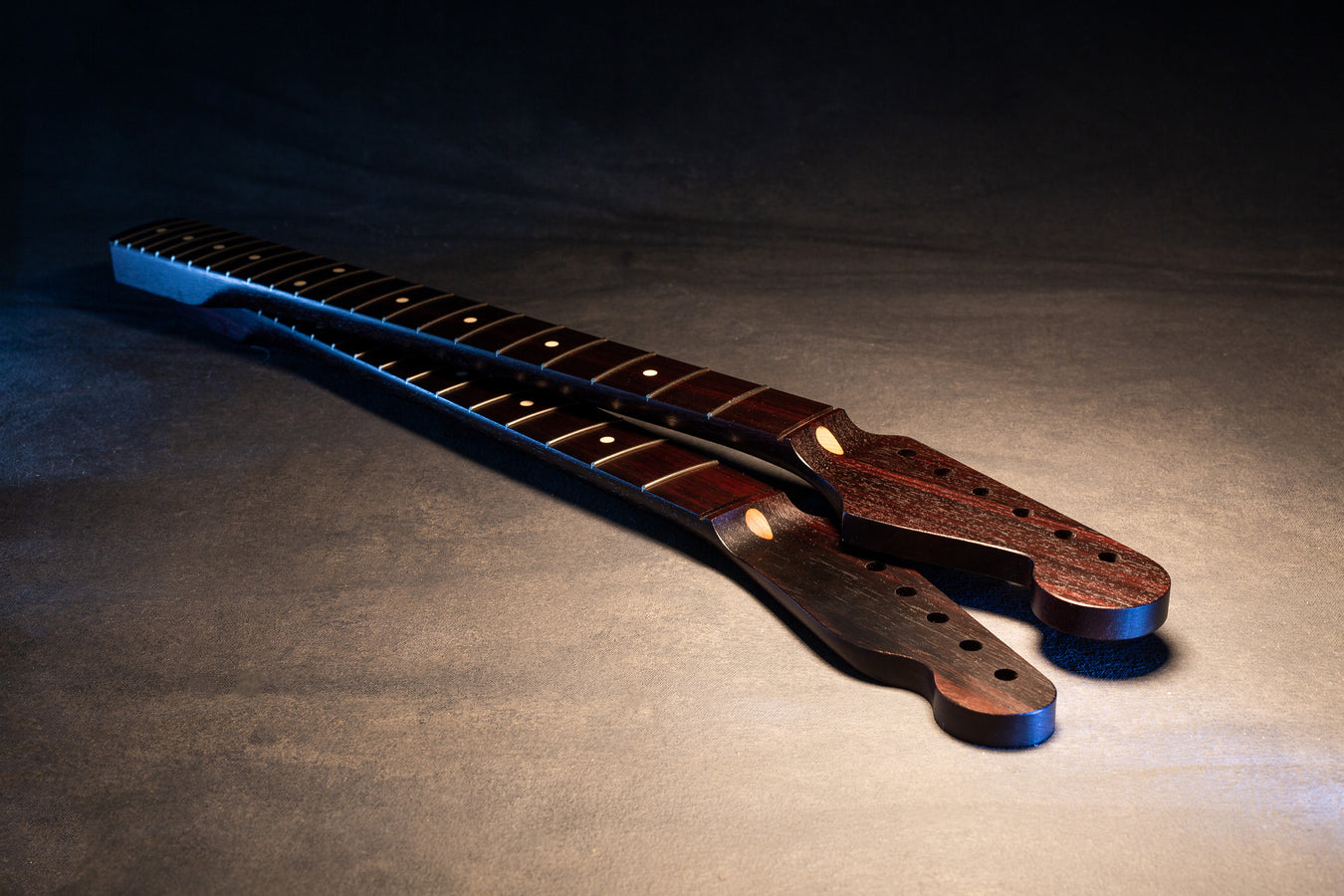 2 rosewood, dark colored guitar necks