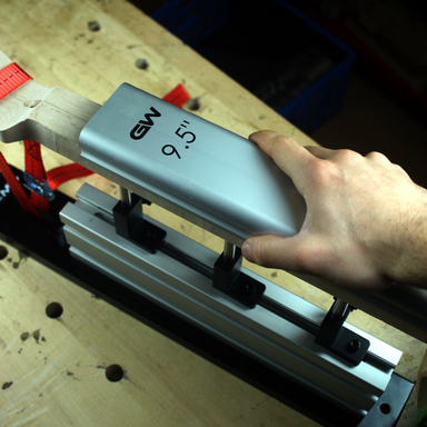 person using the 9.5" Aluminum radius sanding block