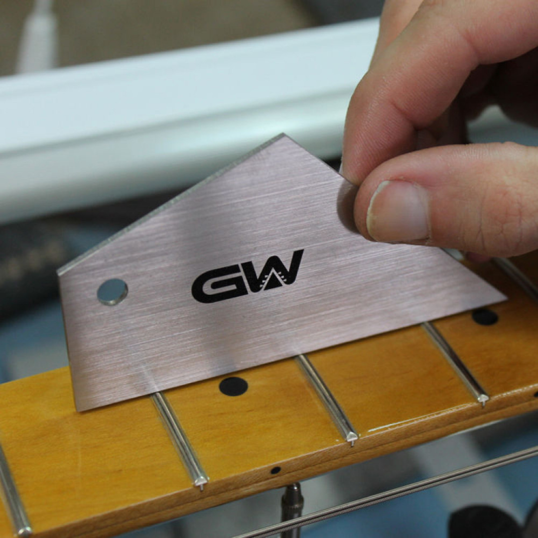Fret Rocker being used on a guitar