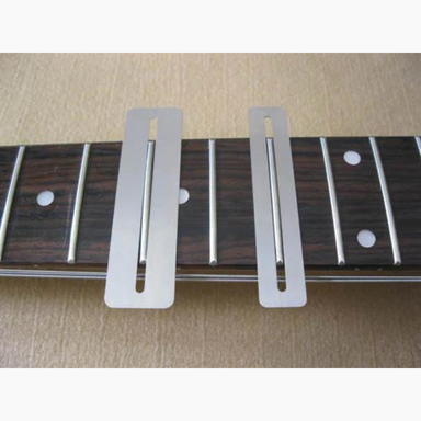 two fingerboard guards on guitar neck