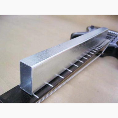 fingerboard leveling block being used on guitar