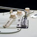 close up of chrome vegatrem bridge on guitar bridge