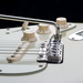 chrome close up view of Vegatrem 2-Point bridge on white guitar
