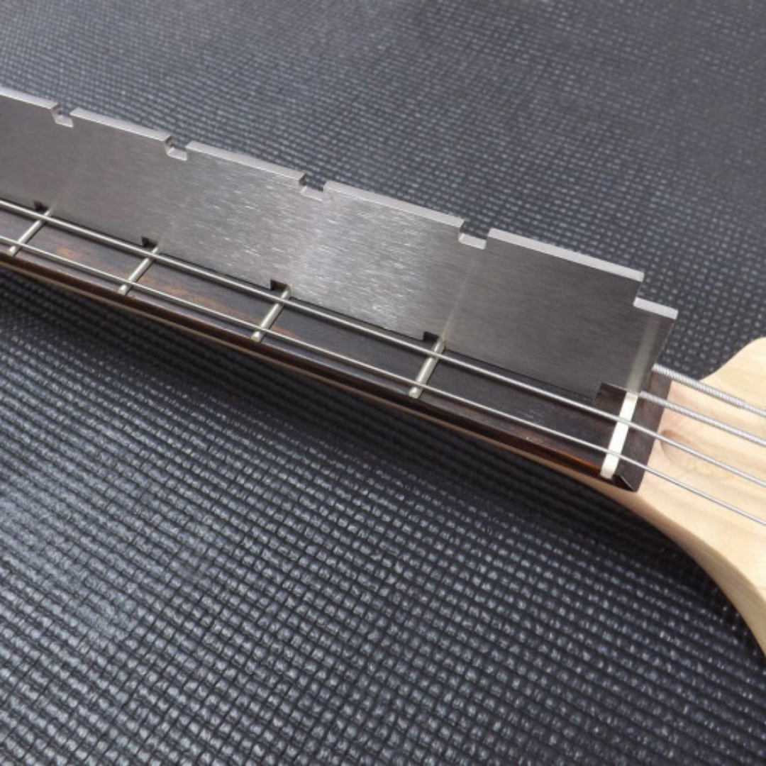 Bass guitar Notched straight edge tool in use back side view