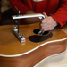Fast Bridge c-clamp and caul in use on acoustic guitar