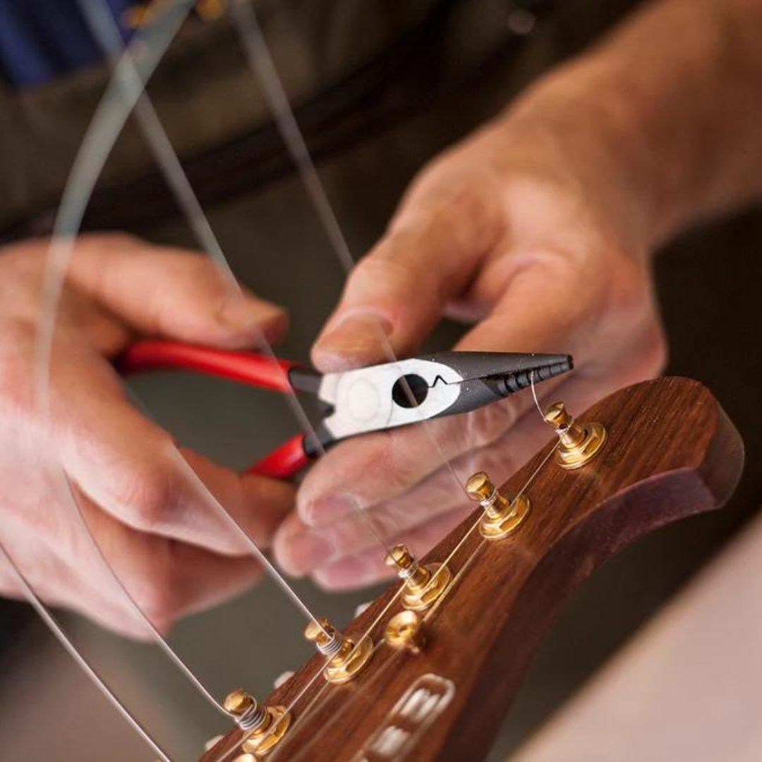 Multi-Purpose Pliers close up of being used on guitar strings