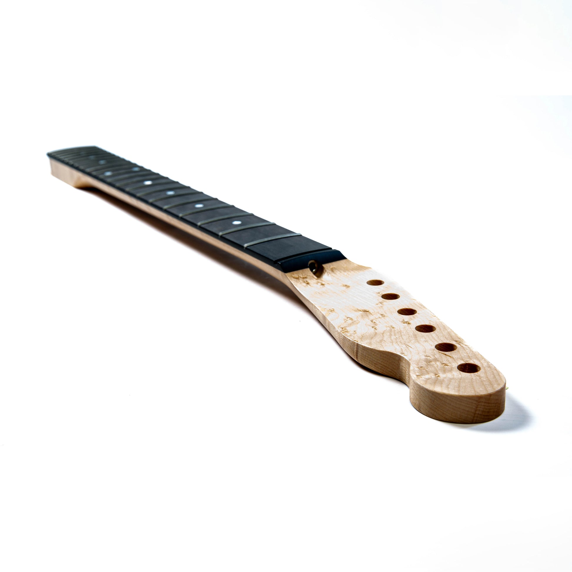 Wooden guitar neck with black frets on a white background
