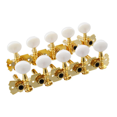 2 rows of fancy gold tuning keys with cream colored knobs