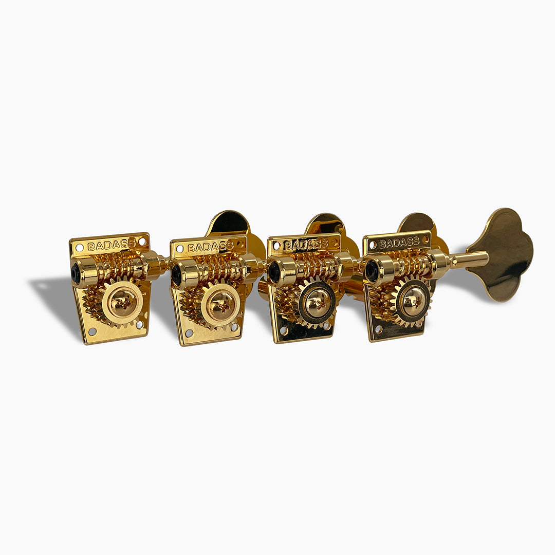 4 inline styled gold bass keys with short posts angled view 