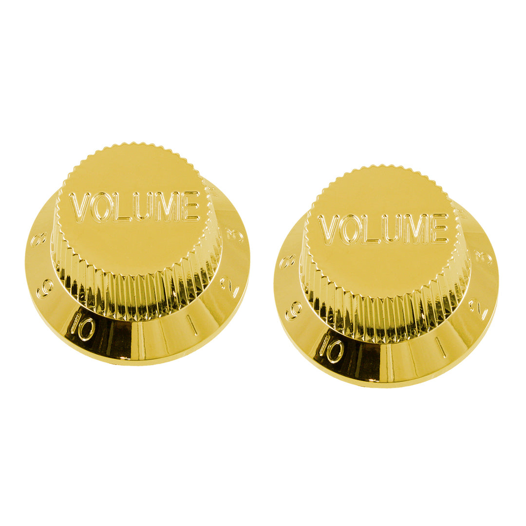 two gold colored volume knobs