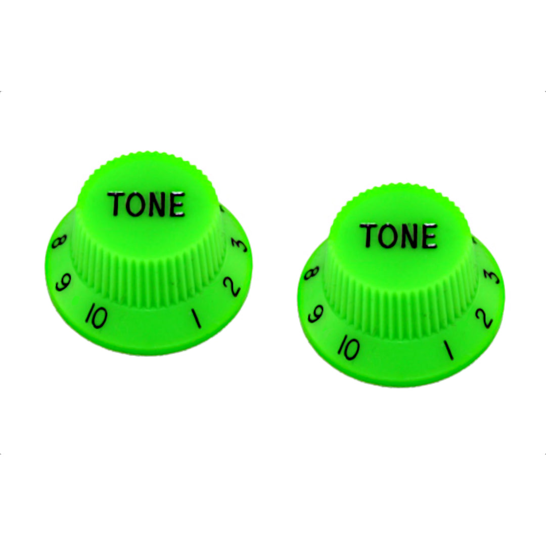 two green strat knobs with the word "tone"