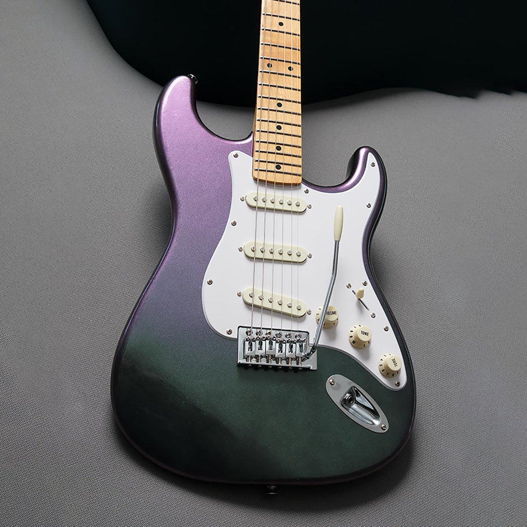 Electric guitar with a gradient purple to black finish on a gray background
