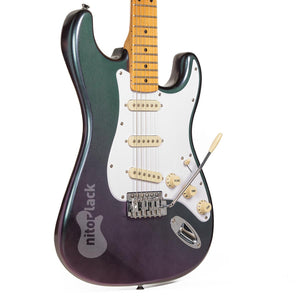 Electric guitar with a black and purple finish on a white background