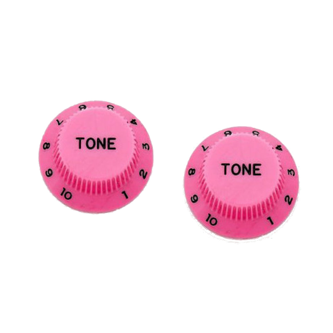 two pink strat knobs with the word "tone"