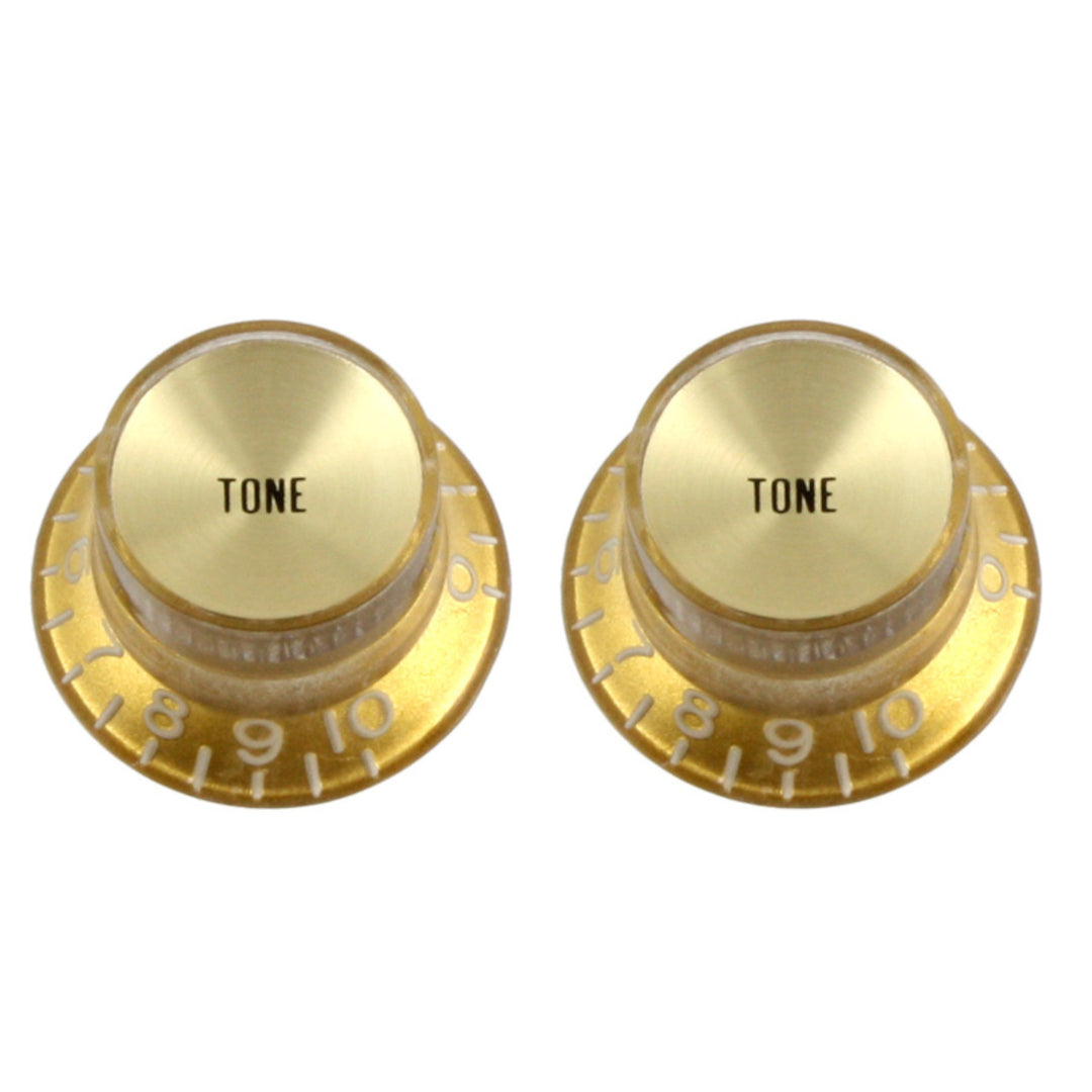 two gold knobs with reflective top