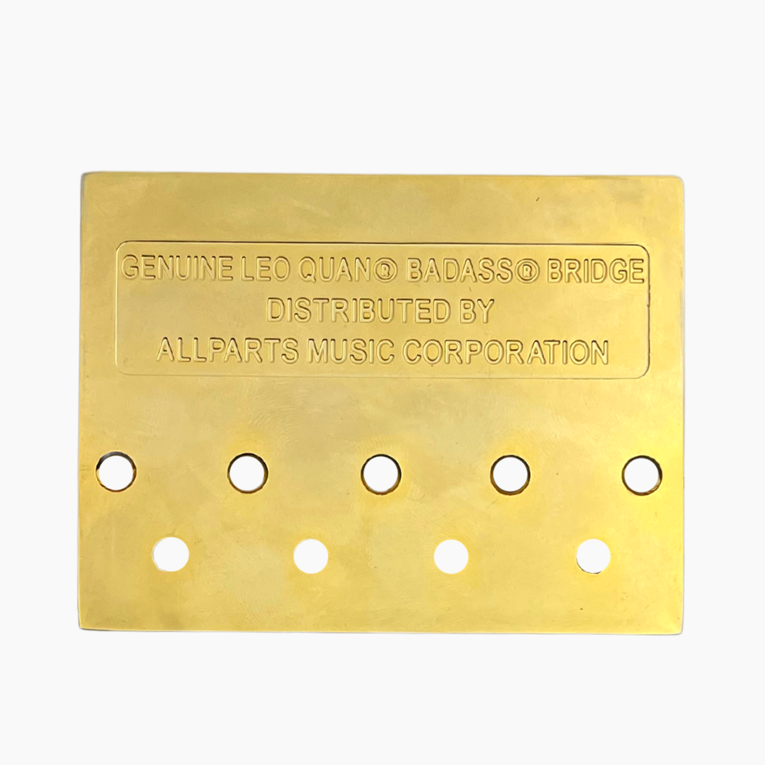 back side of gold 4-string bass bridge