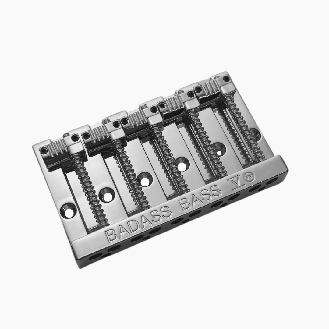 angled view chrome 5-string bass bridge with grooved saddles