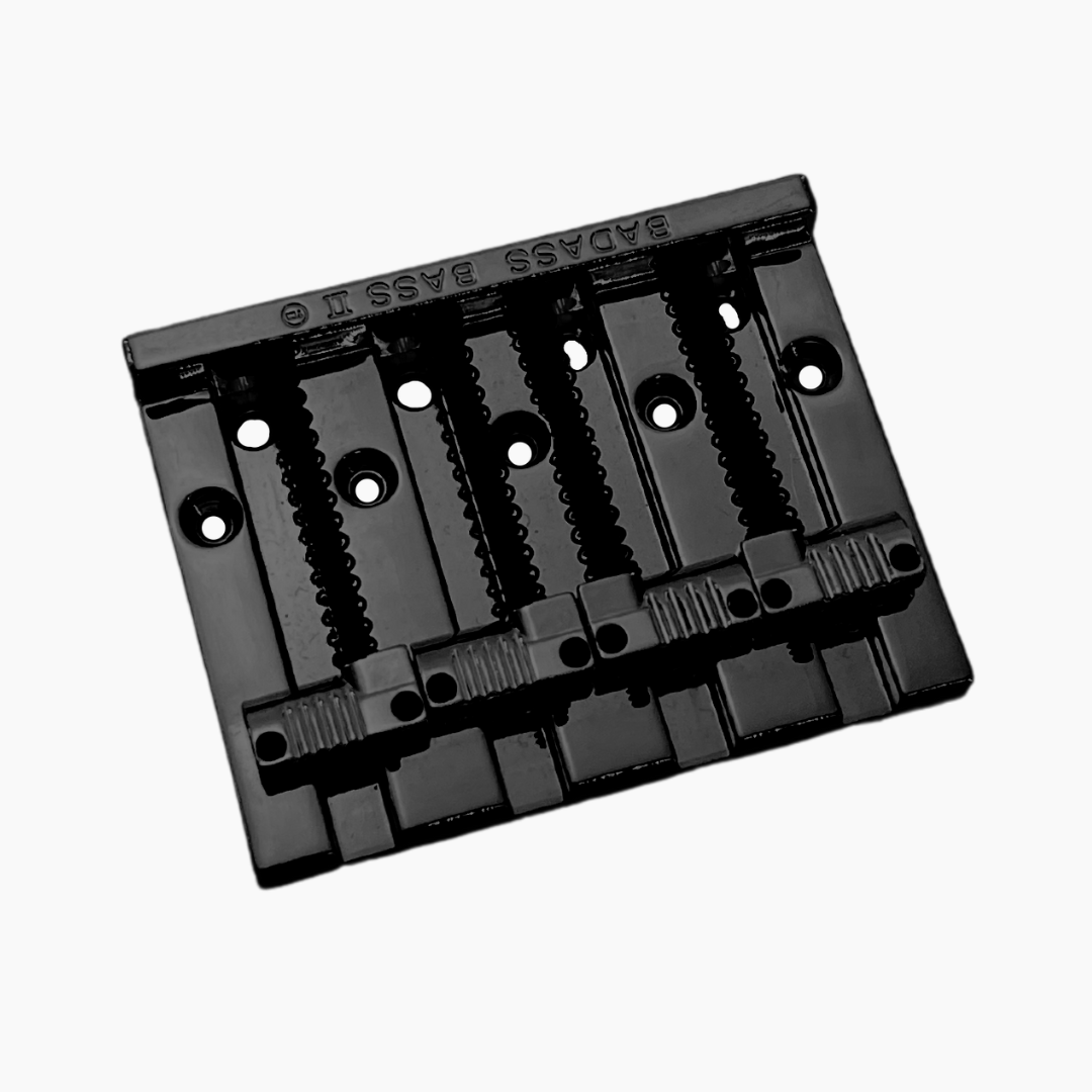 front end view of  black 4-string bass bridge with  grooved saddles