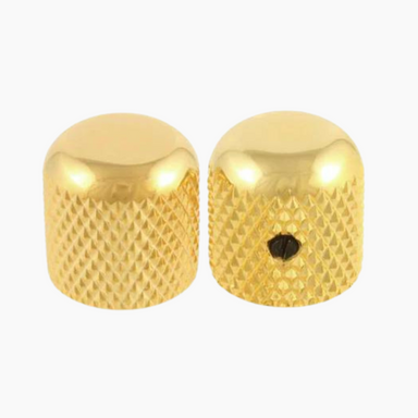 two gold colored metal knobs facing opposite directions